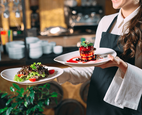 Waiter Holding Plated Food